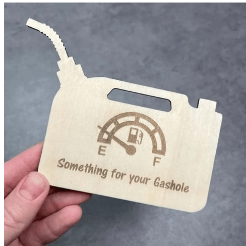 Natural wood gas tank money holder engraved with a fuel gauge design and text