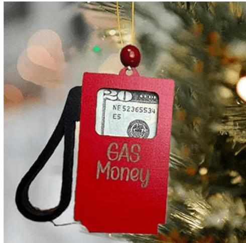 Red gas tank money holder ornament engraved with GAS Money text, holding a twenty dollar bill