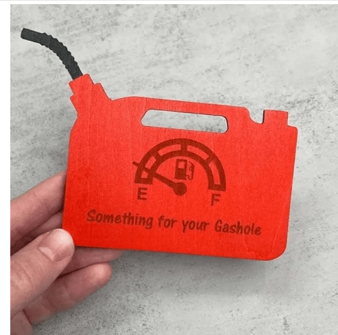 Red gas tank money holder engraved with a fuel gauge design and text