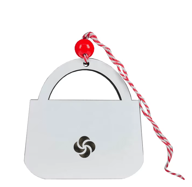 White purse money card holder with pinwheel cutout, red bead, and striped cord