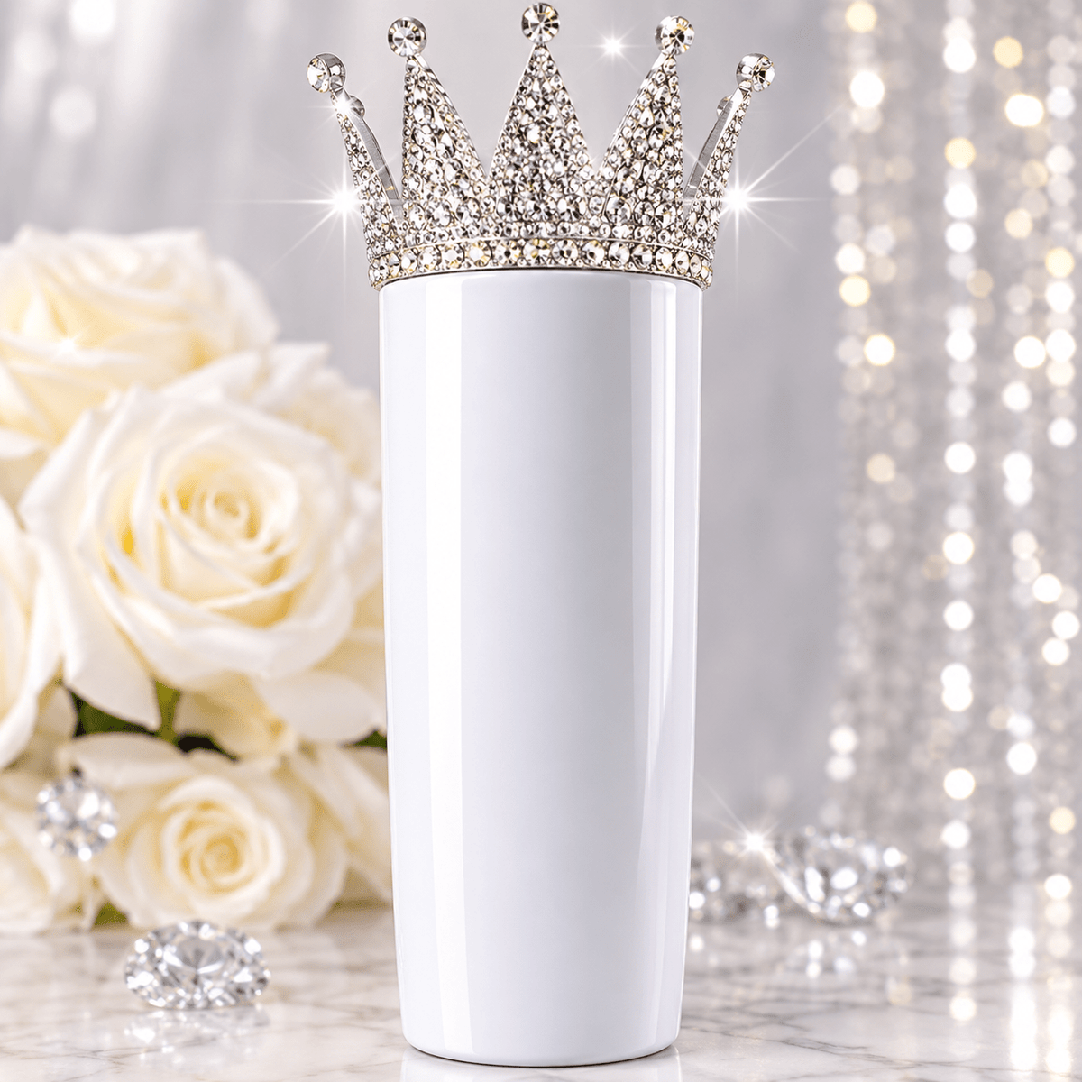 Illustrative styling example of silver rhinestone crown topper on a white tumbler; tumbler not included