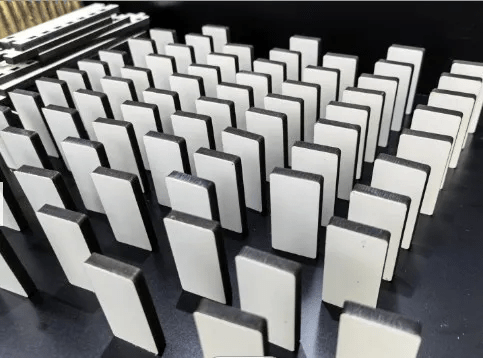 Rows of blank white sublimation domino tiles standing upright