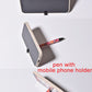 Sublimation ballpoint pen doubling as a mobile phone holder, shown holding a phone