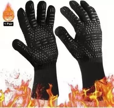 Pair of black heat resistant oven gloves shown over flames