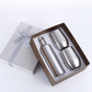 Stainless steel wine bottle and two stemless wine glasses in a ribbon-tied gift box