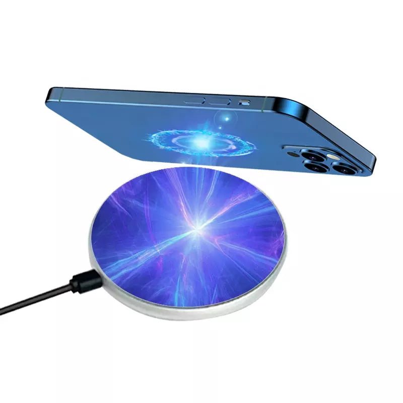 Round sublimation wireless charger printed with a purple cosmic design, shown charging a phone