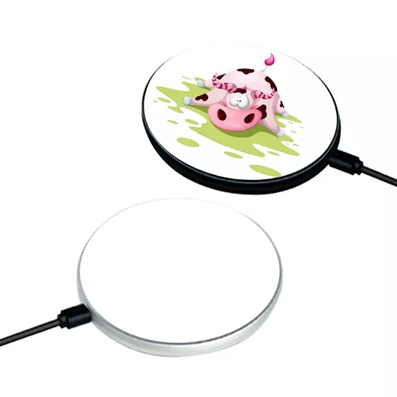 Round sublimation wireless chargers, one printed with a cartoon cow and one blank