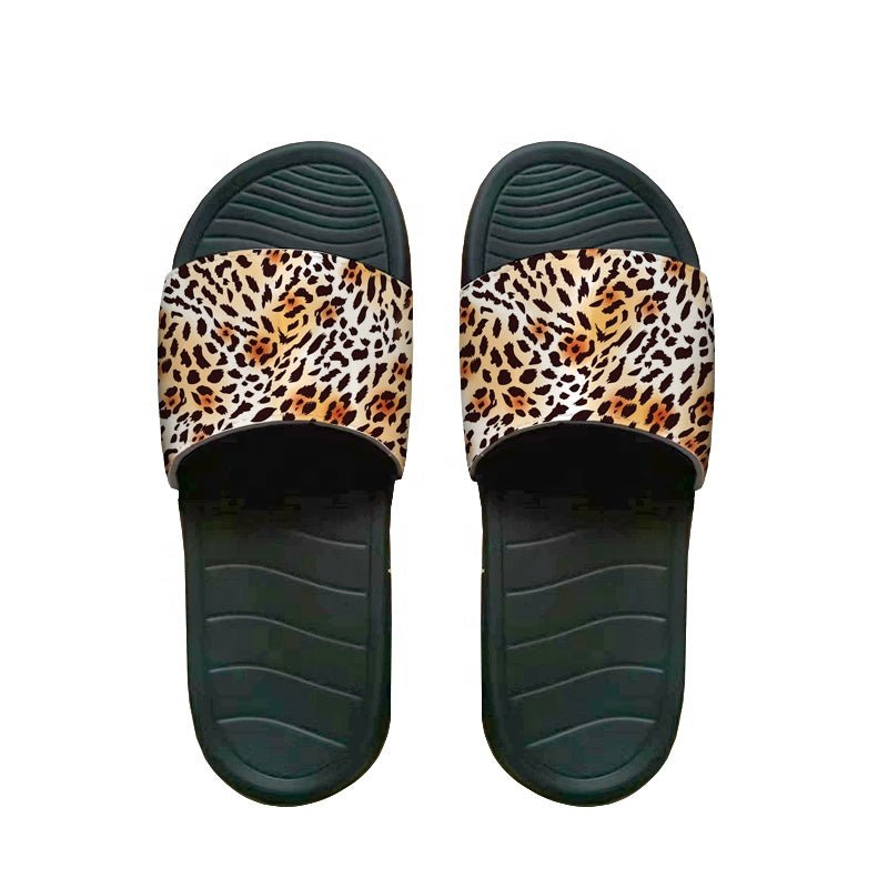Pair of sublimation slide slippers with leopard print straps and black soles