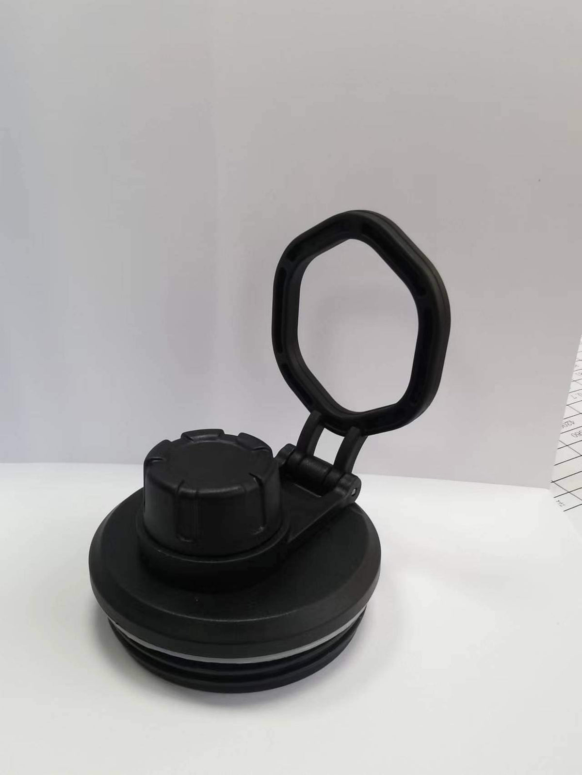 Black water bottle lid with loop handle