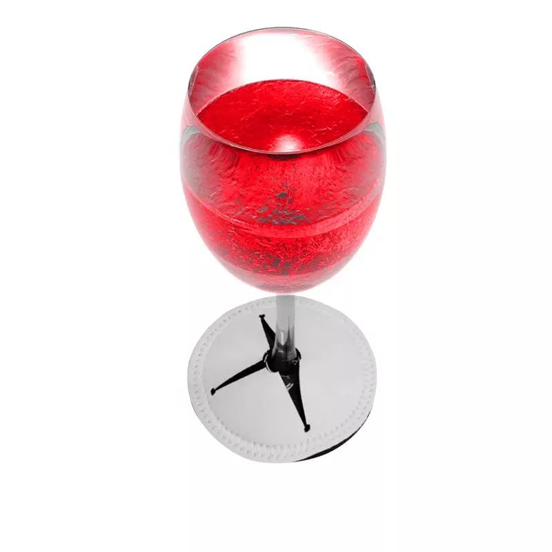 Red wine glass resting in a white sublimation wine glass stem coaster