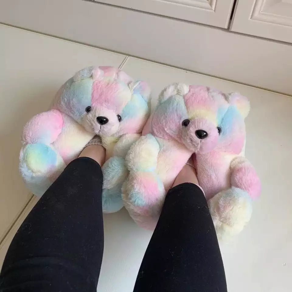 Rainbow pastel teddy bear slippers worn on feet