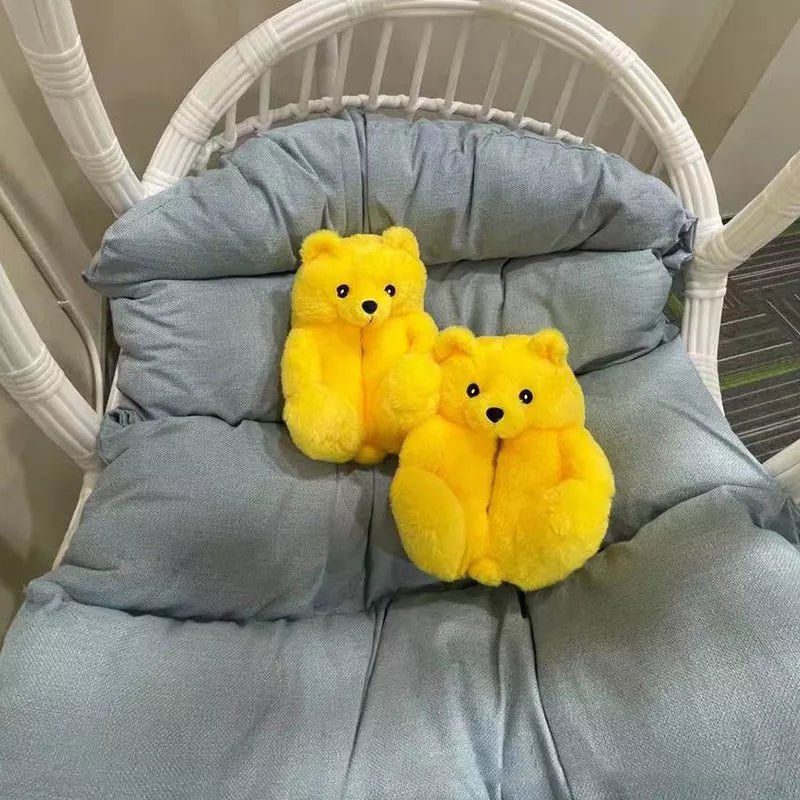 Yellow teddy bear slippers on a chair